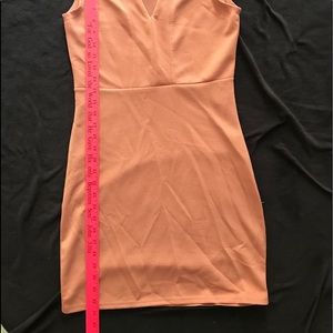 Ladies dress. Sleeveless. Form fitting.